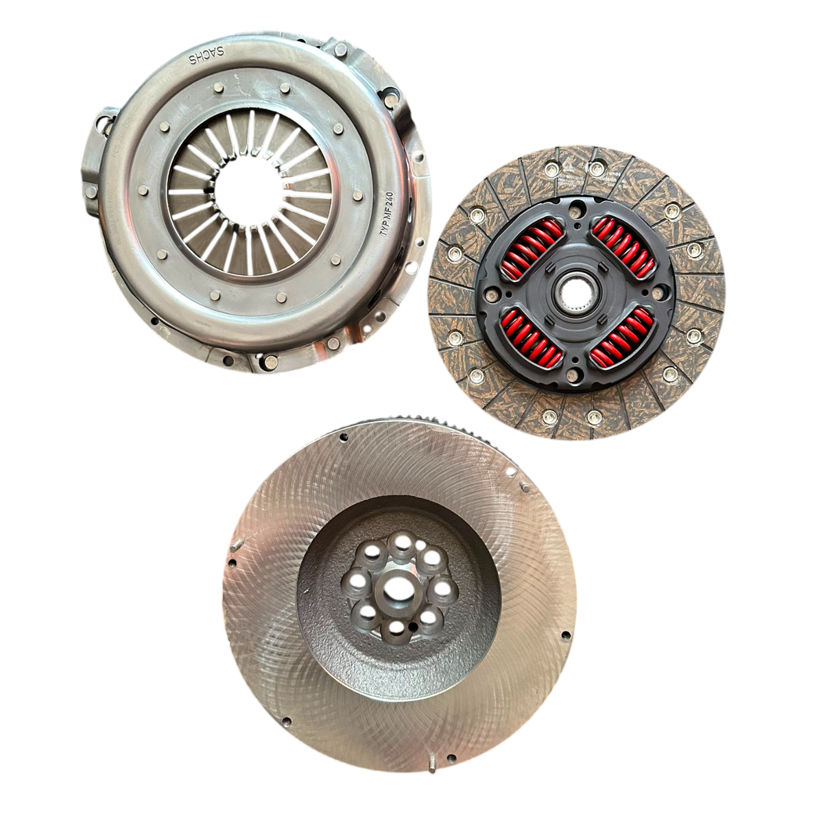 A set of three automotive clutch components, including a pressure plate, clutch disc, and release bearing, displayed against a solid white background.